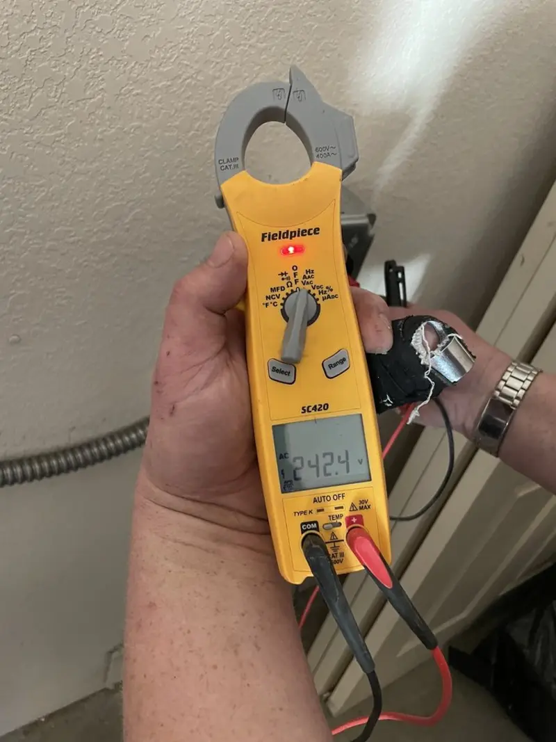 Voltage testing with clamp meter during Ceiling Fan Installation in Rockville